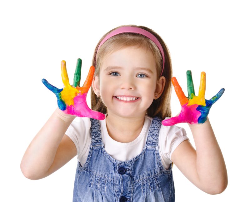 Beautiful smiling little girl with hands in the paint isolated on white